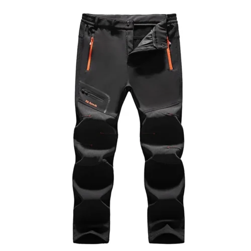 Sb2c42fd11442493ab9b8bd621f1064b3Iwebp Black hiking pants with orange zipper pockets and reinforced knee padding.”,